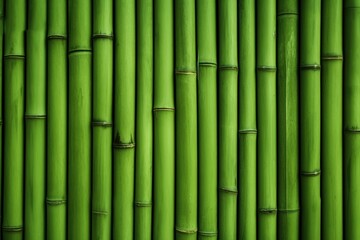 Fototapeta premium A close-up view of vibrant green bamboo stalks arranged vertically, showcasing their texture and natural beauty.