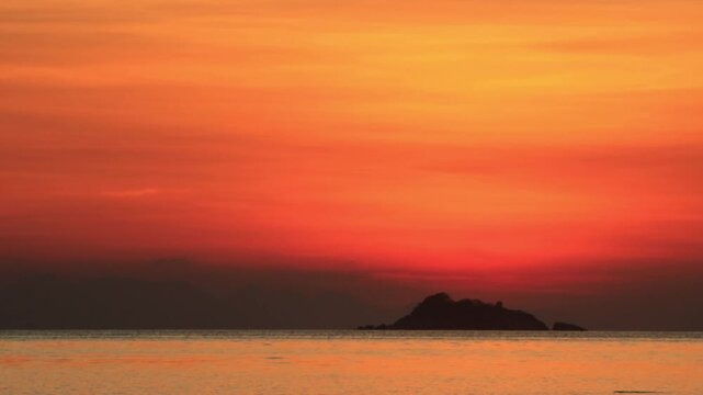 wide sunset cinematic b-roll footage of silhouette mountain and ocean on ko pha ngan thailand