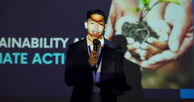 Expo, sustainability and climate change with man at seminar for conference, environment or speaker. Discussion, keynote speech and presentation showcase with person and microphone for tradeshow