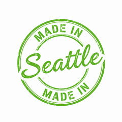 Green circular grunge vector stamp for 'Made In Seattle' local origin