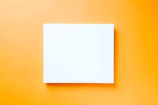 Clean white book cover, closed, positioned centrally on a bright orange background, ample copy space