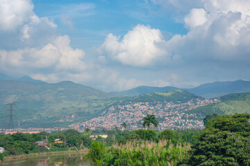 A beautiful perspective of Valle del Cauca, Colombia, showcasing lush green hills and clouded skies, capturing the region's natural beauty.