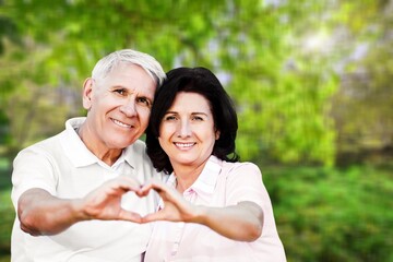 Obraz premium Happy senior love couple relax in the park.