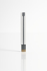 Fototapeta premium Up white test strip standing vertically on mirror surface with clear reflection and minimalistic background, showing medical diagnostic tool