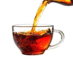 Hot tea being poured into a glass cup