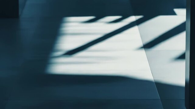 Sunlight casting strong parallel geometric shadows and bright light stripes on a modern tiled floor, forming an abstract background for design and architecture concepts