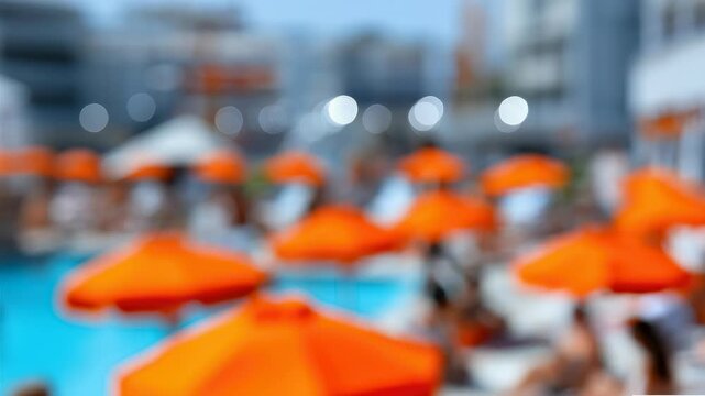Blurred urban poolside with orange umbrellas on a sunny day