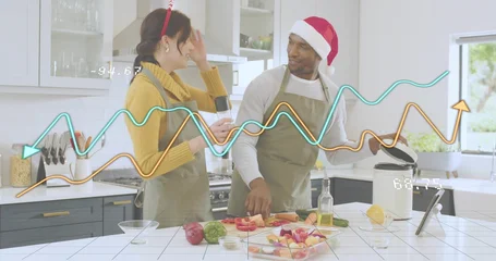 Selbstklebende Fototapeten Zu Kochen Preparing couple with reindeer headband and Santa hat chopping at kitchen island slow cooker tablet  © vectorfusionart
