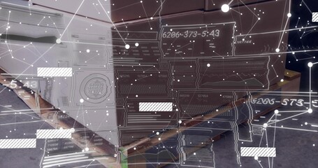Displaying wooden pallet carrying boxes in storage, showing green strap, tape and schematic overlay