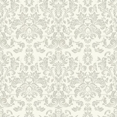 Fototapeta premium Ornate Seamless pattern. Lace damask background with dense swirls in beige color for invitations, textiles, wallpapers. Monochrome classic backdrop.
