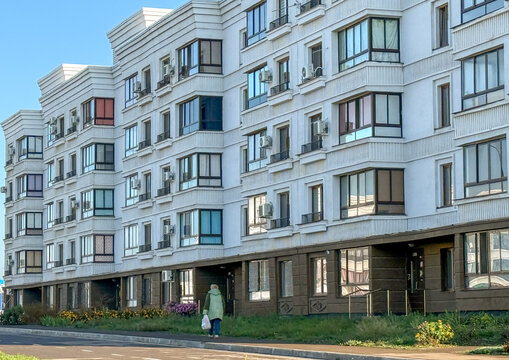 Modern white apartment building with air conditioning units, Donetsk Oblast, Mariupol, Ukraine