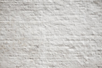 Wei&szlig; get&uuml;nchte Backsteinwand als Hintergrund