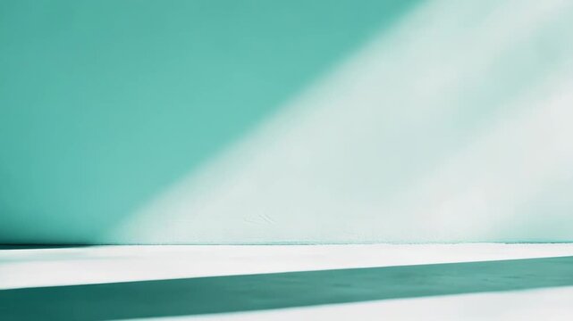 Empty studio stage with parallel light and shadow lines in soft teal gradient, minimalist wall and floor backdrop offering clean copy space for product display or advertising visuals