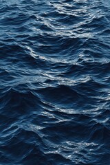 Fototapeta premium Vibrant photo of Deep blue ocean water surface with ripples and small waves