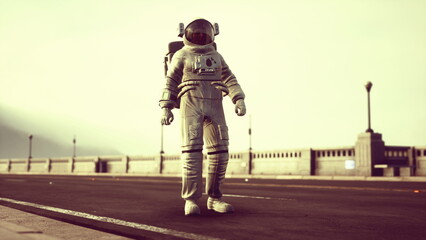Fototapeta premium An astronaut in a white spacesuit stands alone on a deserted street under a hazy sky. The quiet surroundings hint at a surreal adventure in an unexpected landscape.