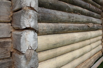 beautiful natural wooden logs stacked in a row	
