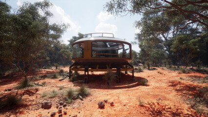 A striking round house stands tall in the heart of the Australian bush. Surrounded by native vegetation, the structure captures sunlight, showcasing a blend of modern design with natural beauty.