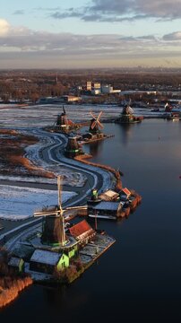 Dutch windmills at zaanse schans winter sunrise