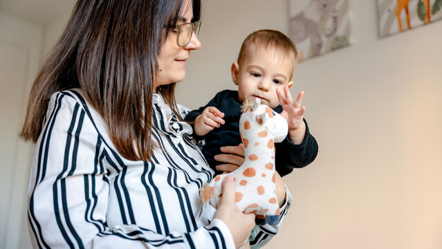 Mother and baby enjoying cozy family time at home