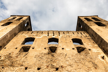 Ancient Castle Wall with Medieval Architecture and Stone Arches