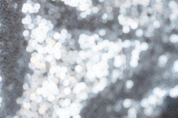 Soft blurred metallic foil texture with abstract light bokeh