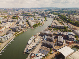 Fototapeta premium Bristol England: 28th July 2025: Drone view of Brunel's SS Great Britain rests at the dock in Bristol, surrounded by historic buildings along the River Avon