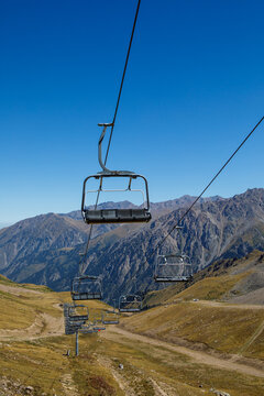 Almaty, Kazakhstan ski lift, cable car cabin at Medeo to Shymbulak route against mountain background