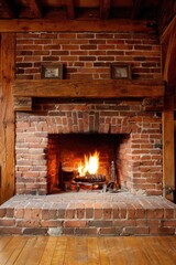 Cozy brick fireplace with warm fire, wooden beams, and small framed art