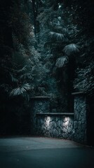 An eerie stone wall lit by spotlights at dusk, obscured by lush, dark foliage above