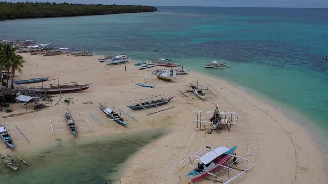 Aerial view of small boats near tropical beach