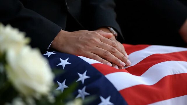 Hands on an american flag remembrance and tribute concept