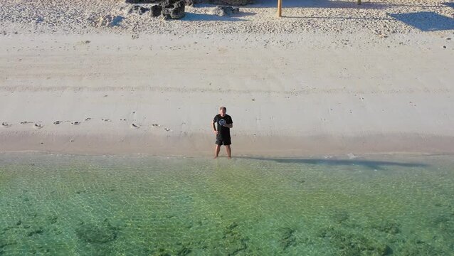 Top view of person standing in shallow water