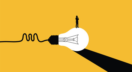 A small figure standing at the top of a glowing lightbulb symbolizing a breakthrough idea.