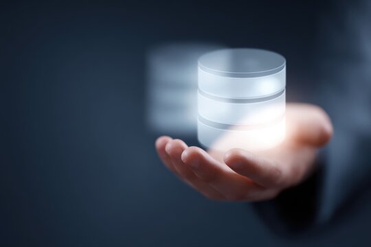 Business hand holding virtual database server icons cloud computing technology innovation