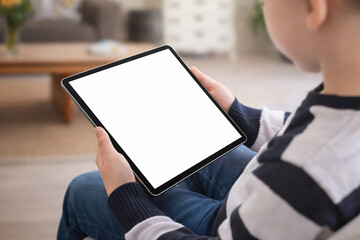 Child Holding Tablet with Blank White Screen at Home &ndash; UI UX App Mockup