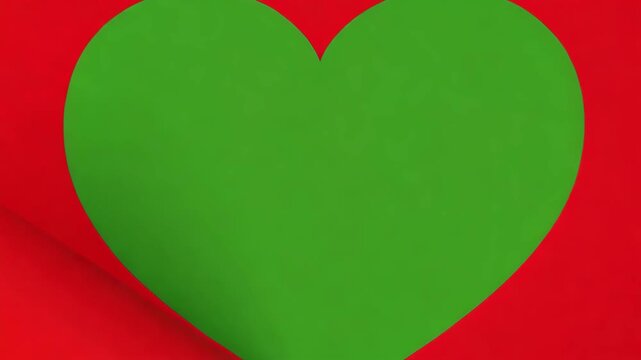 Green heart shape on red background with curled paper edge detail