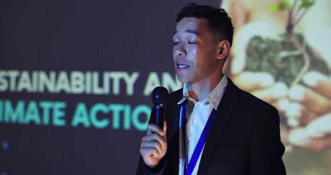 Expo, sustainability and climate change with man and microphone for conference, environment or speaker. Panel discussion, keynote speech and presentation showcase with person for tradeshow seminar