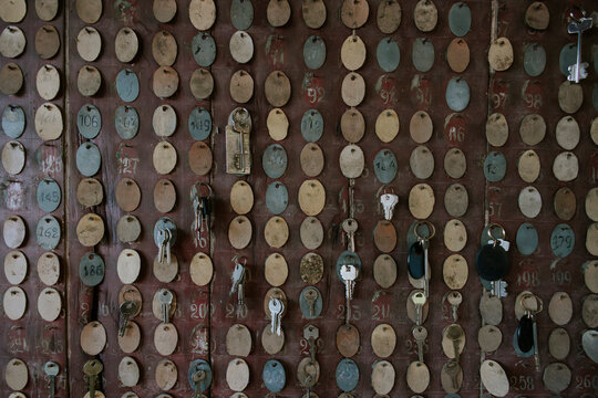 Vintage key collection on an old wooden board