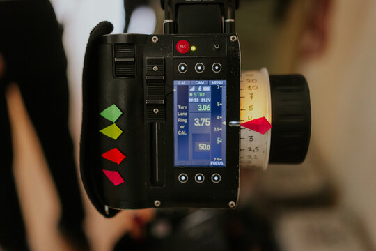 Close-up of a professional camera monitor displaying settings