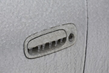 Frozen car handle in cold weather