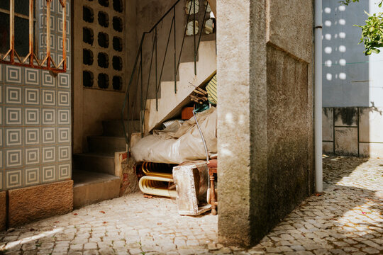 Weathered urban corner with hidden clutter