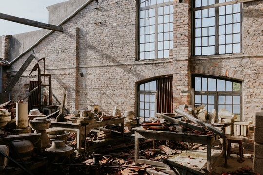 Abandoned industrial warehouse with scattered debris