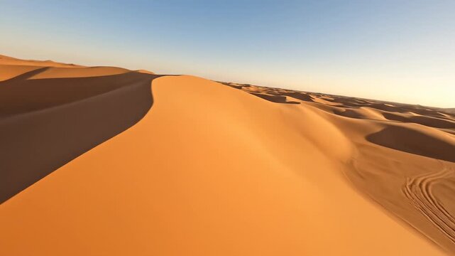 Sweeping drone aerial shot over vast desert sand dunes revealing complex wind-formed parabolic lines and soft, natural, abstract geometry seamless, beauty, grand