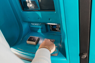 Person inserting credit card into payment terminal