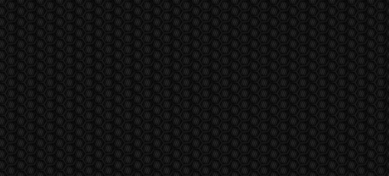Black carbon fiber texture with hexagonal honeycomb pattern. Abstract dark metallic background for automotive luxury design, racing sport backdrop, and modern tech wallpaper. Seamless fiber surface.