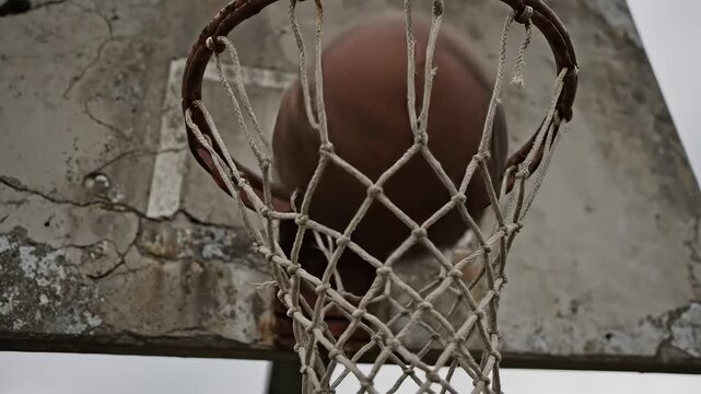 Old basketball hoop with cracked backboard