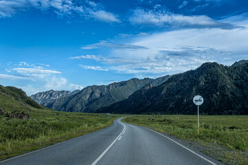 Winding road among picturesque mountain peaks
