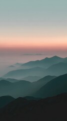 Vertical landscape, misty mountains at sunrise