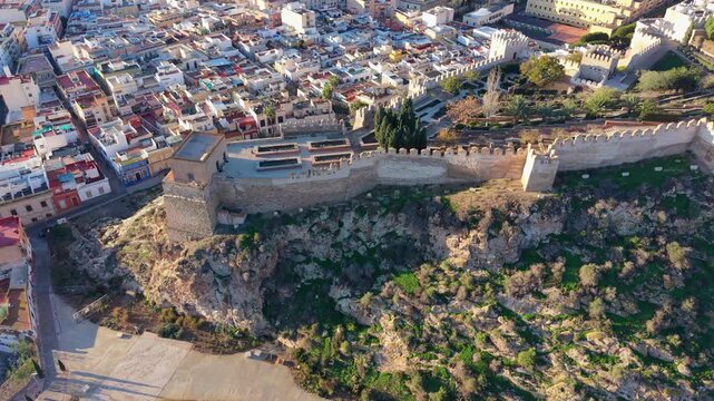 Majestic aerial view of the Alcazaba fortress and the historic city of Almeria during sunset