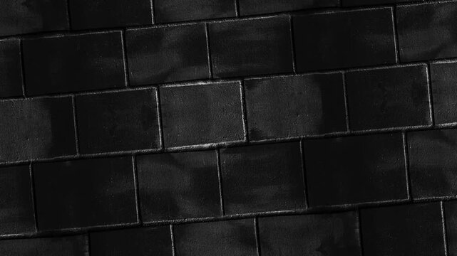 Black Stone Tile Wall Texture Background with Rectangular Blocks for Luxury and Modern Architectural Designs
